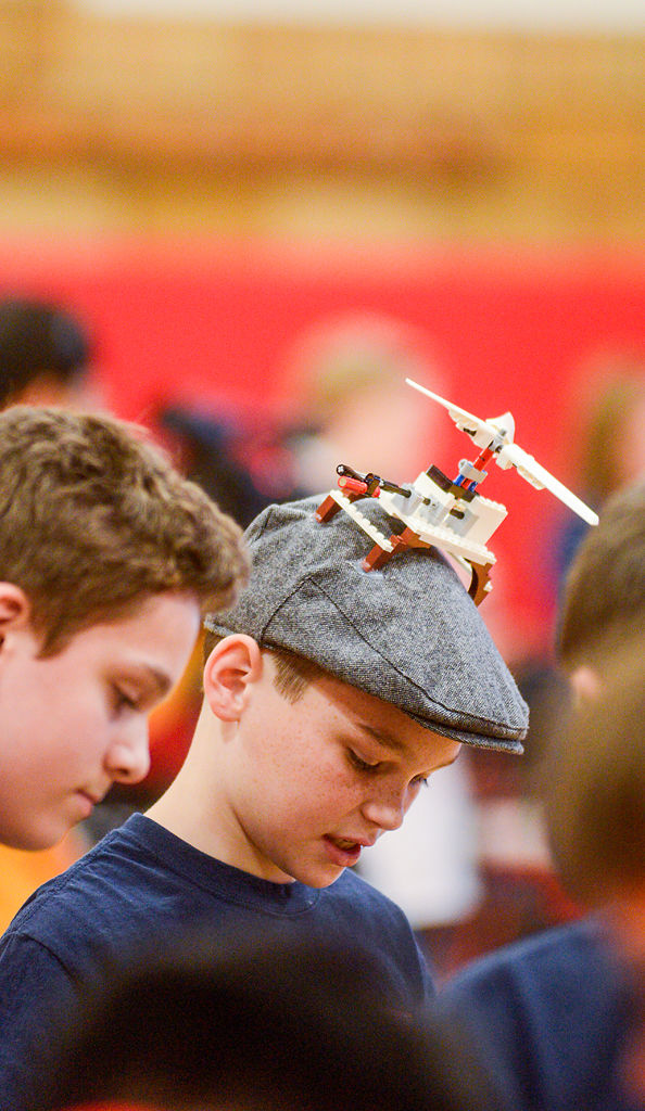 Riley Johnson, 11, wears a cap with a LEGO contraption